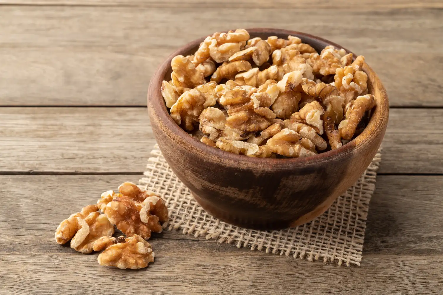 A close-up view of a whole walnut kernel.