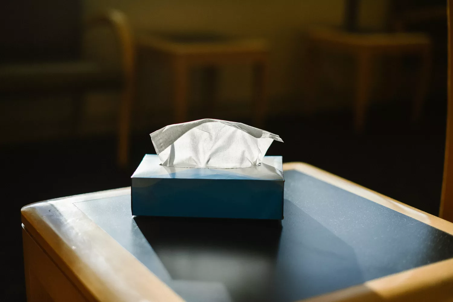 A box of white facial tissues ready for use.