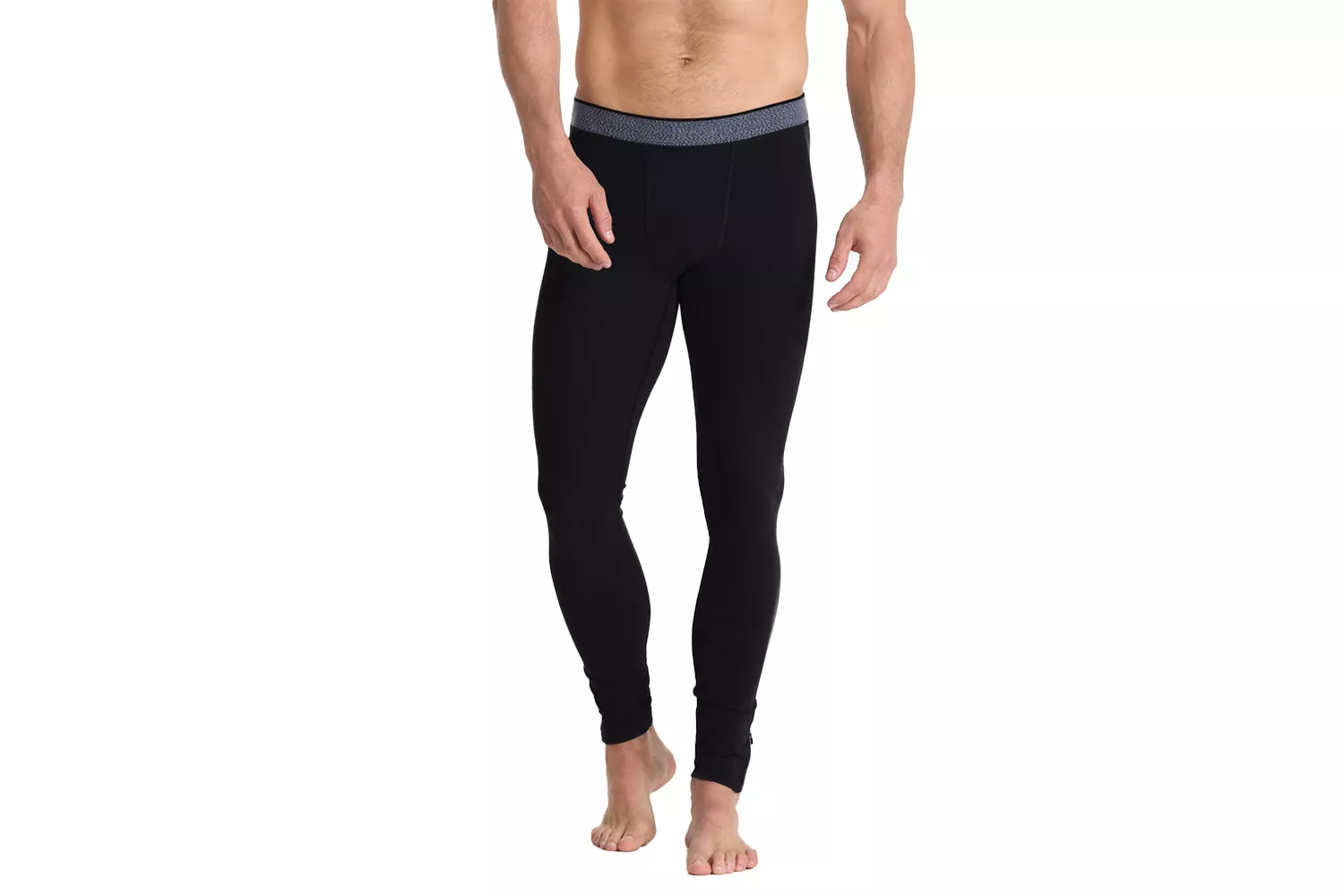 A male model wearing black compression tights with a gray patterned waistband.