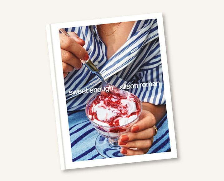 The 'Sweet Enough' cookbook by Alison Roman alongside freshly baked pastries.