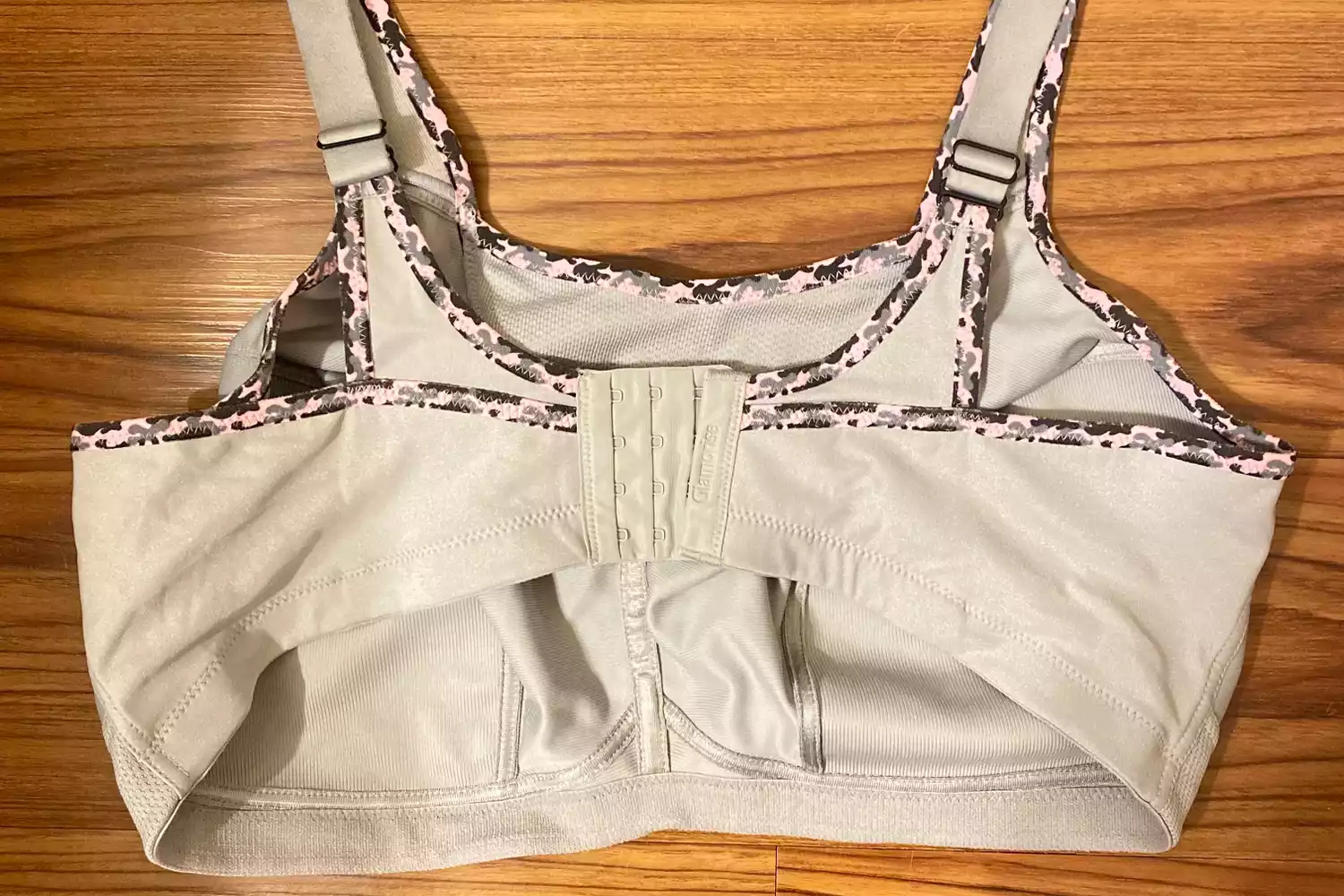 A wire-free sports bra with comfortable patterned trim and hook-and-eye closure.