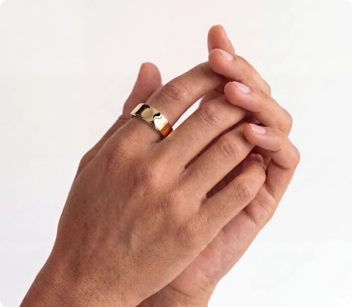 High-resolution shot of a smart ring and a medical-grade sensor side-by-side.