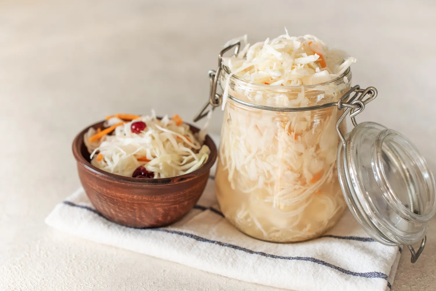 Fermented sauerkraut stored in a glass mason jar.