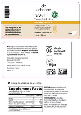 Arbonne BeWell Vitamin D3 & K2 Spray Pineapple Flavor source label used in the packaging illustration